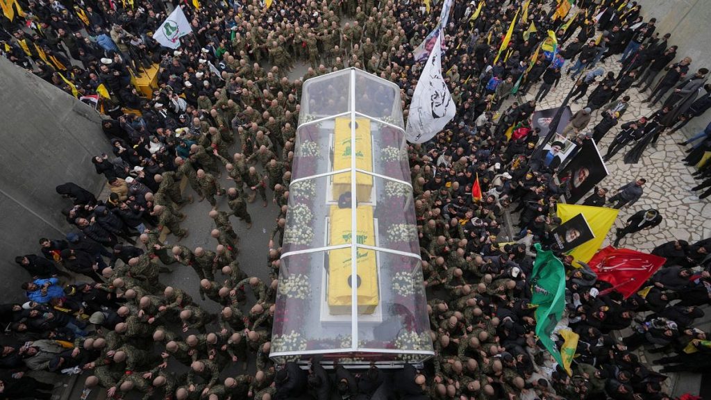 A trailer carrying the coffins containing the bodies of Hezbollah