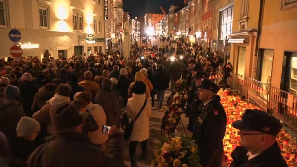 Resident of Villach, Austria take part in a funeral procession for the 14-year-old victim of a stabbing attack, Tuesday, 18 February, 2025.