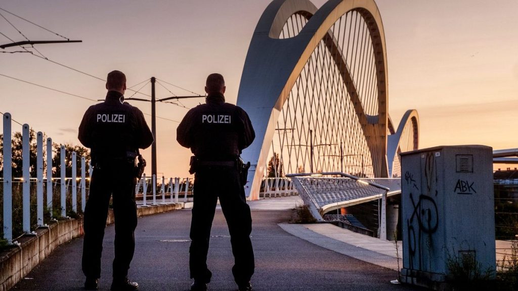 FILE - German police officers stand at a bridge over the river Rhine at the border between Germany and France in Kehl, Germany, 15 September 2024.