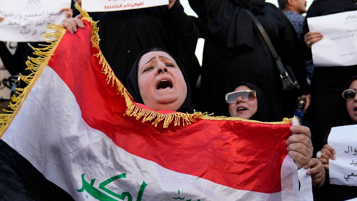 FILE - Protesters gather to demonstrate against a proposed law to permit underage female marriage in Tahrir Square in Baghdad, Iraq, 8 August, 2024.