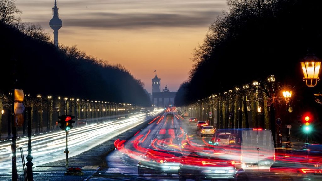 Cars move towards the Brandenburg Gate in Berlin