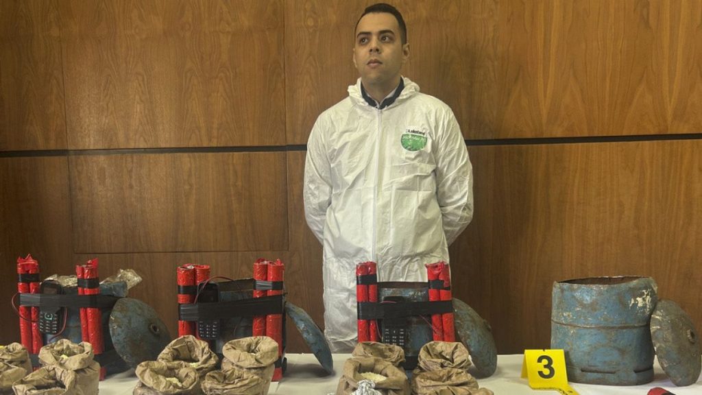 A Moroccan DGST police investigator stands at the Central Bureau of Judicial Investigations in Sale, Morocco, Monday, Feb. 24, 2025.