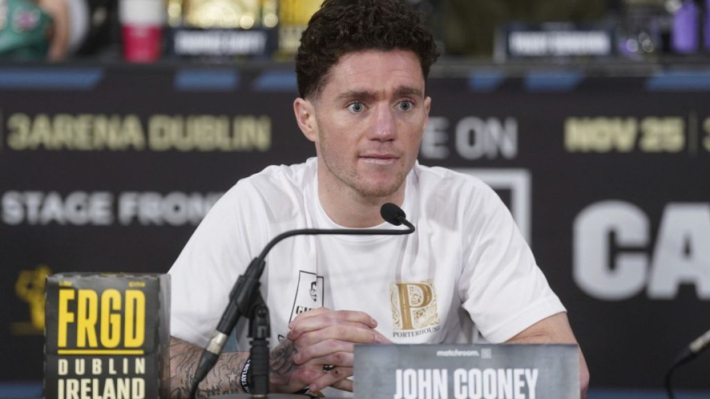 Boxer John Cooney listens during a news conference, Nov. 23, 2023, in Dublin. (Brian Lawless/PA via AP)