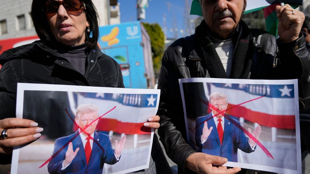 Palestinians carry defaced pictures of U.S. President Donald Trump while protesting against his statements regarding the transfer of Palestinians from Gaza, 29 January 2025.