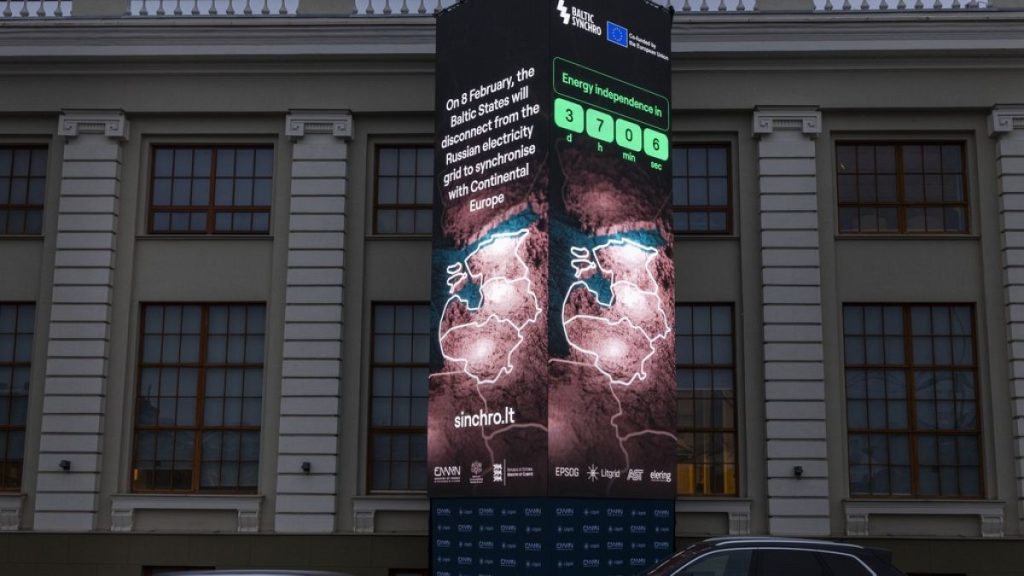 A screen stating that 8 the Baltic States will disconnect from the Russian electricity grid in Vilnius, Lithuania, Tuesday, Feb. 4, 2025. (AP Photo/Mindaugas Kulbis)