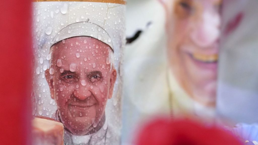 Candles and flowers for Pope Francis are seen at the Gemelli Polyclinic in Rome, 25 February, 2025