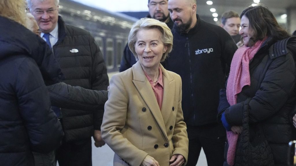 European Commission President Ursula von der Leyen, center, arrives at a train station on the third anniversary of the Russian invasion of Ukraine, Kyiv, Ukraine, Monday, Feb.