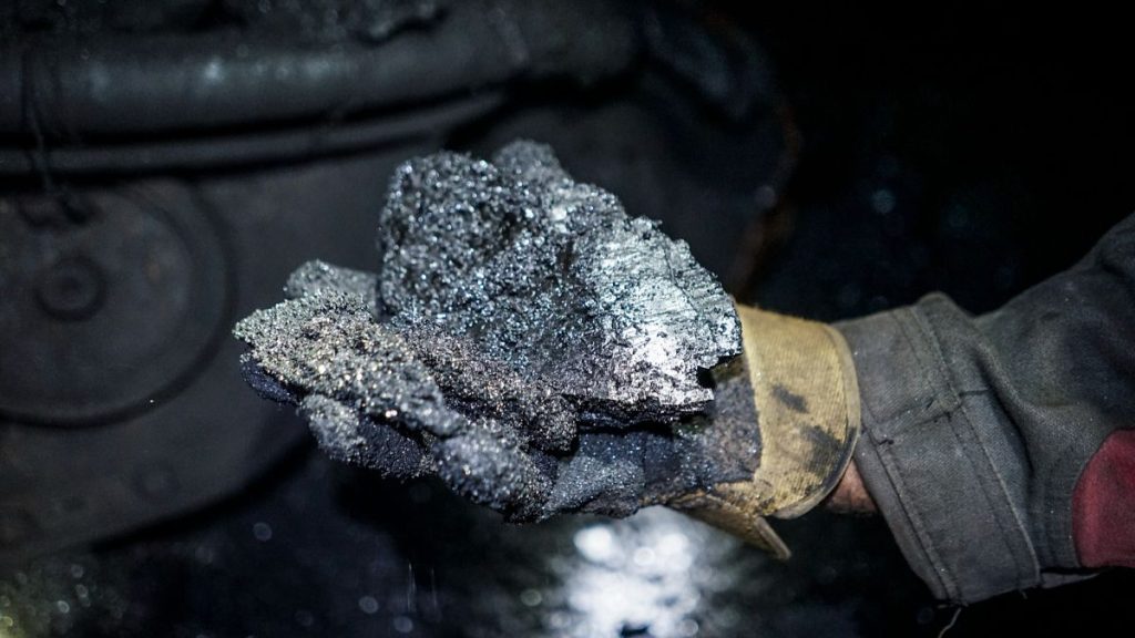 FILE: A miner shows a lump of coal at one of the Krasnodonugol coal mines in Krasnodon, 6 August 2015