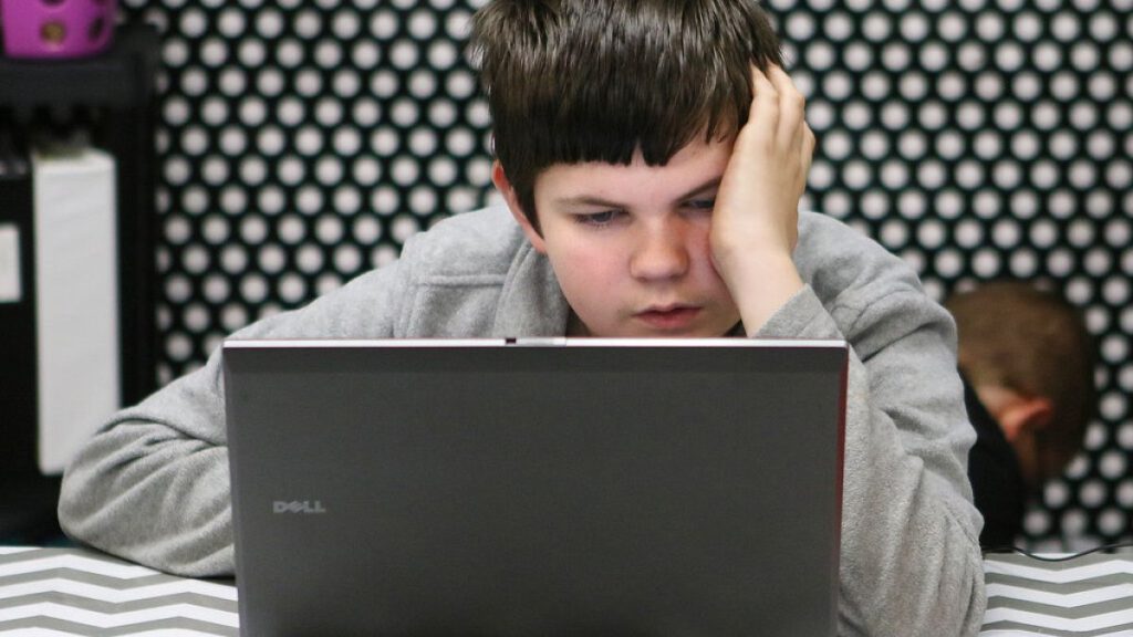 A teenager on his laptop