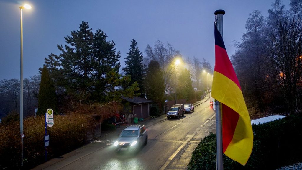 A German flag waves over the Main Street in Oberreifenberg near Frankfurt, Germany, Thursday, Jan. 16, 2025.