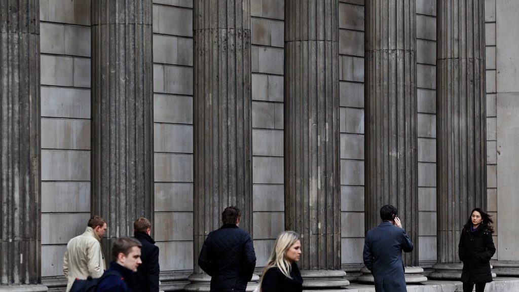 File photo of people walking outside the Bank of England, in London