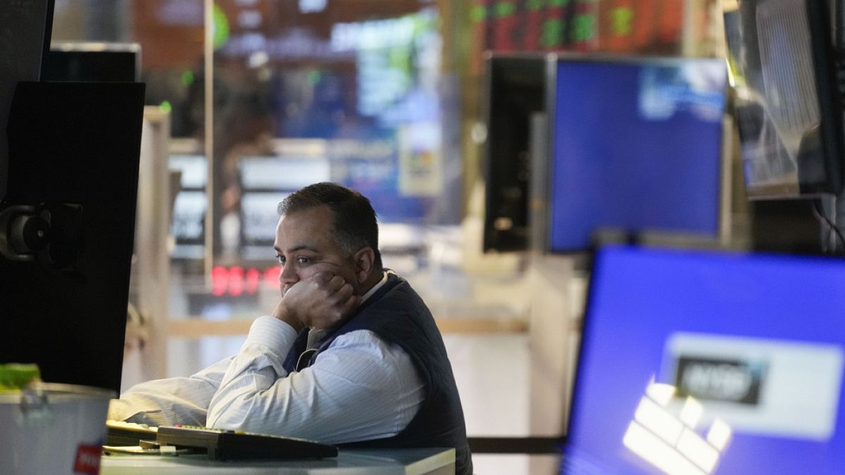 A trader works on the floor at the New York Stock Exchange in New York, Monday, Feb. 3, 2025.