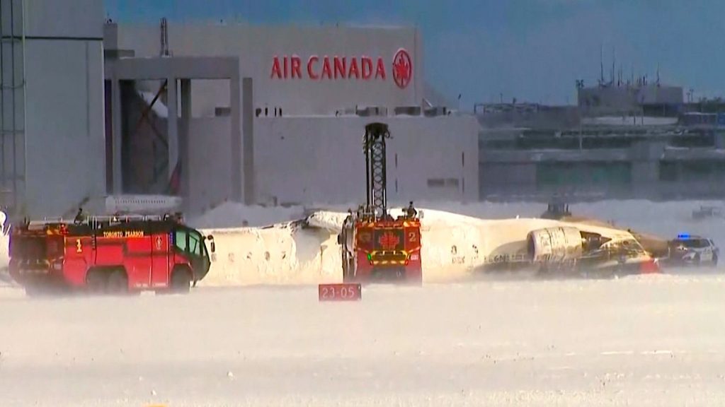 This image taken from video provided by CTV shows emergency crews responding at Toronto Pearson Airport after a plane crash, 17 February, 2025