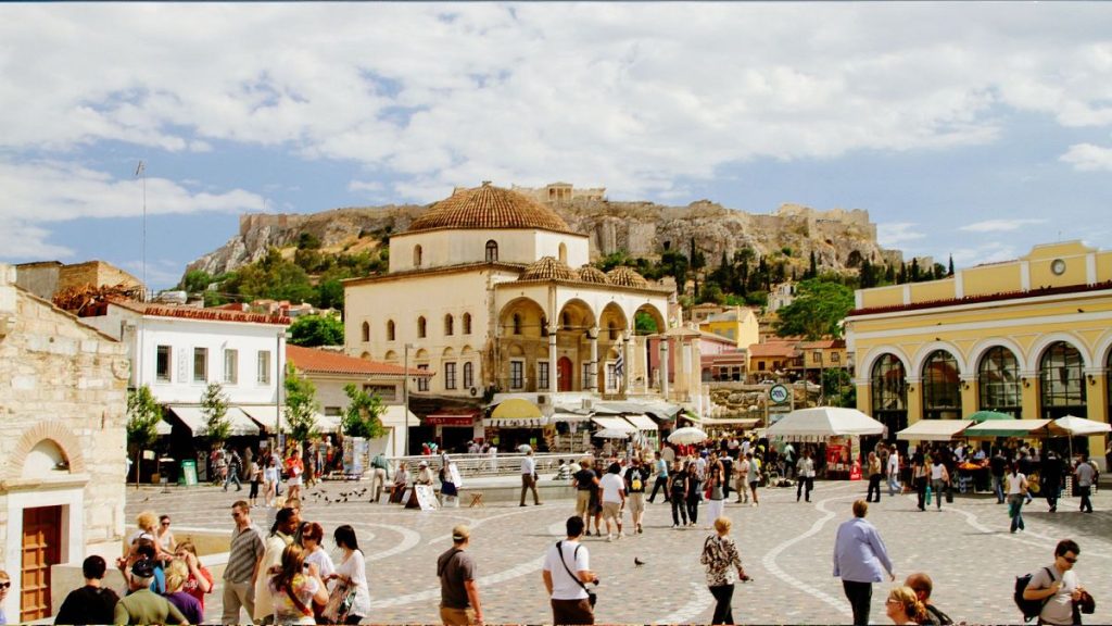 People walking in Monastiraki square in Athens, Greece.