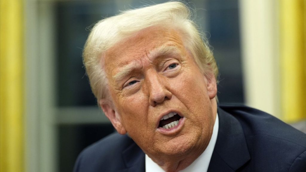 President Donald Trump speaks with reporters as he signs executive orders in the Oval Office at the White House, Monday, Feb. 10, 2025, in Washington.
