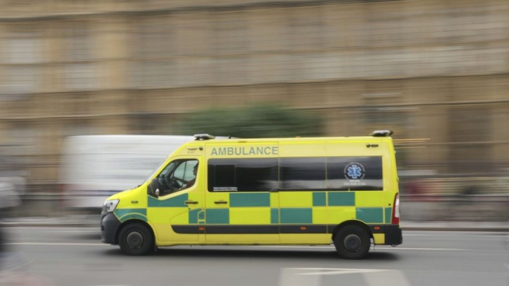 An ambulance drives past the Houses of Parliament as Prime Minister Keir Starmer makes a major speech on the NHS, in London, Thursday, Sept. 12, 2024. (AP Photo/Kin Cheung)