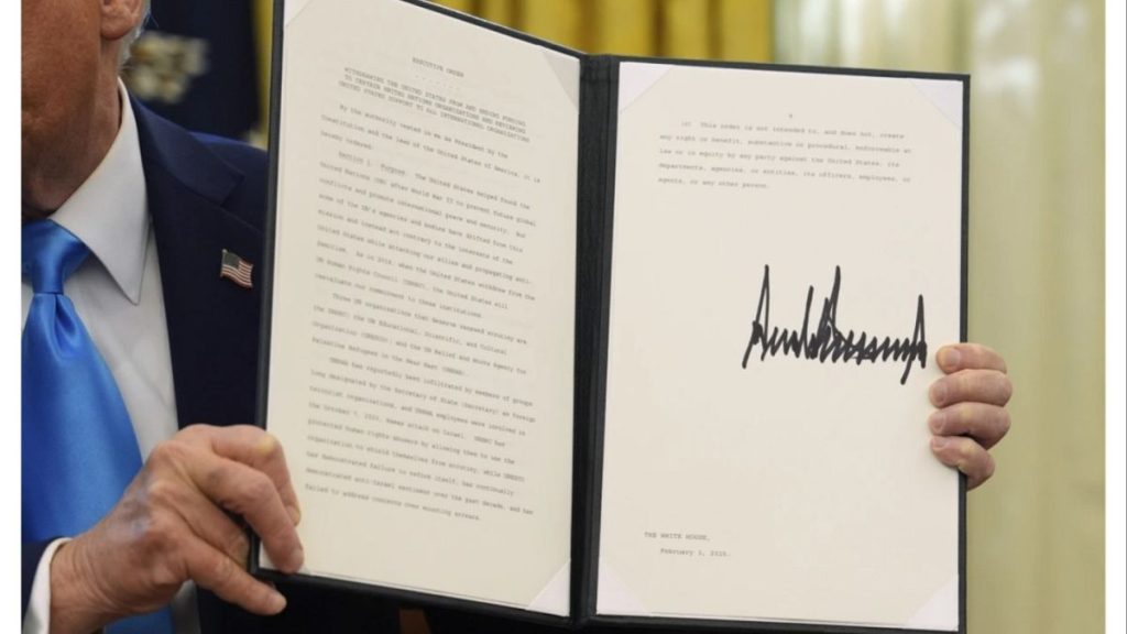 President Trump holds an executive order regarding withdrawing from UNHRC in the Oval Office, Feb 4.
