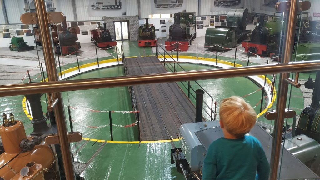 Admiring the engines at the railway museum, both at Statfold Country Park in the Midlands, UK.