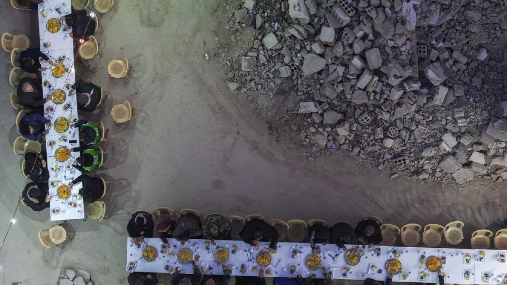 Residents gather for iftar, the fast-breaking meal, organized by the Turkish Humanitarian Relief Foundation (IHH), on the first day of Ramadan