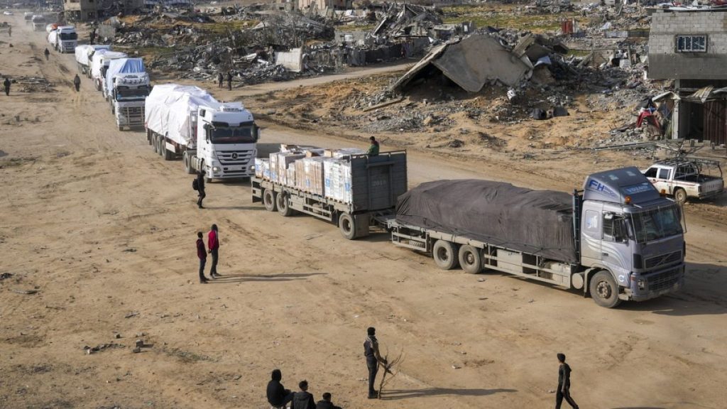 FILE - Trucks carrying humanitarian aid enter the Gaza Strip from Egypt in the southern Gaza town of Rafah, Wednesday, Feb. 12, 2025.(AP Photo/Abdel Kareem Hana)