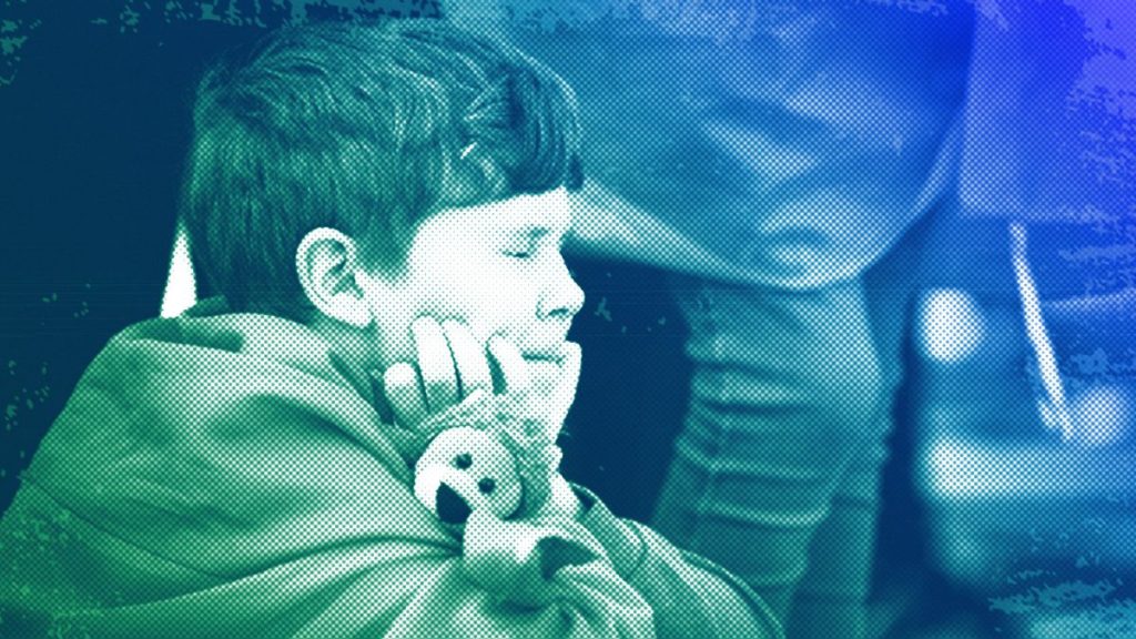 A child reacts as sounds of an air raid are played on loudspeakers during an artistic portrayal of the life of Ukrainian civilians during war, in Bucharest, 24 February 2024