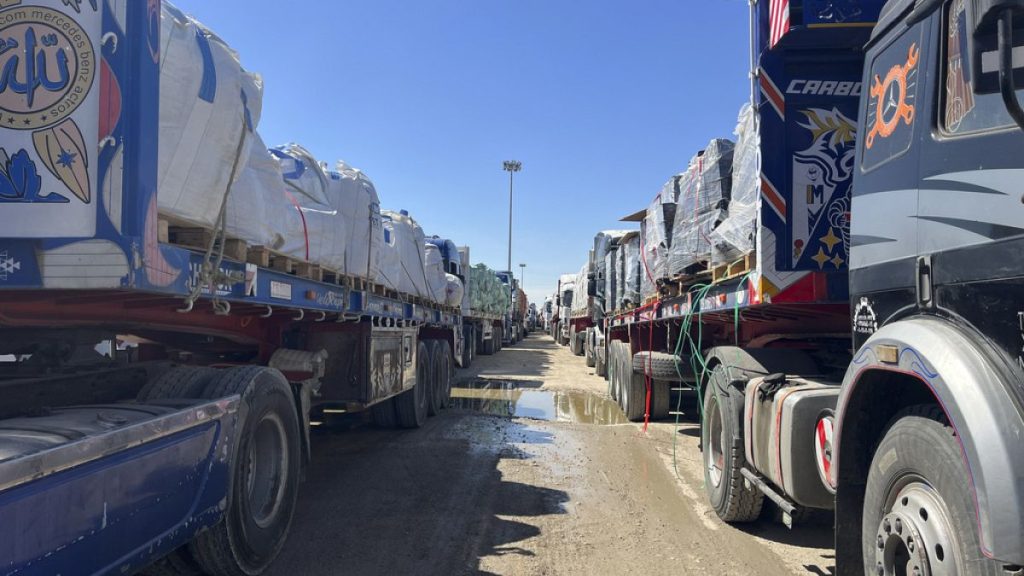 Trucks line up at the Egyptian side of the Rafah border crossing between Egypt and the Gaza Strip after Israel blocked the entry of aid trucks into Gaza, Sunday, March 2, 2025