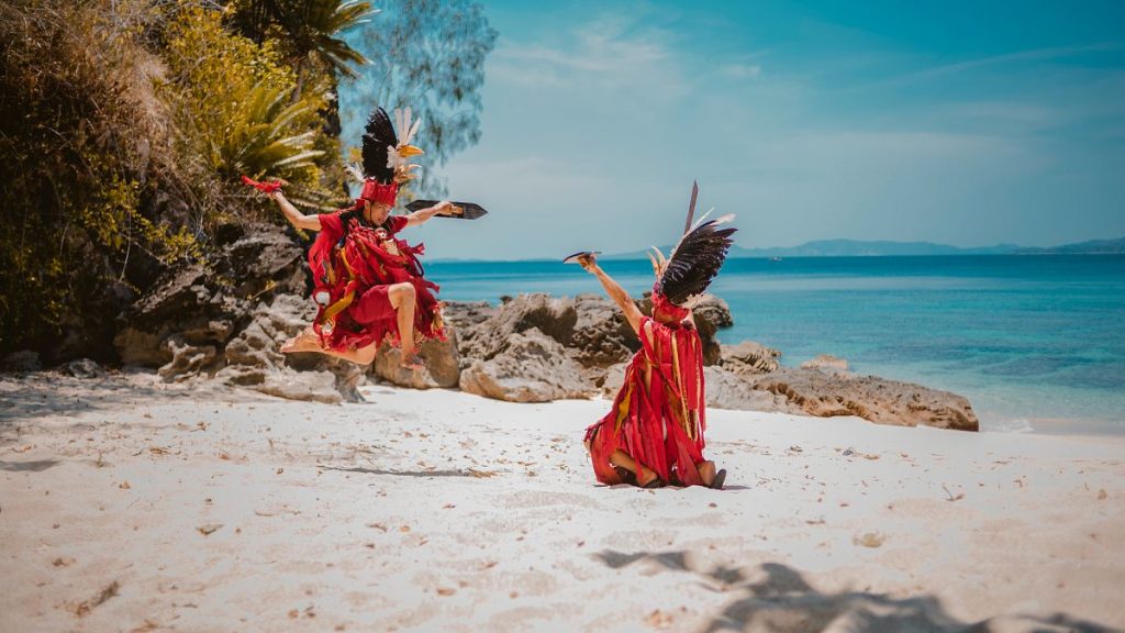 Kabasaran dance performed on Pulisan Beach, Likupang, Indonesia