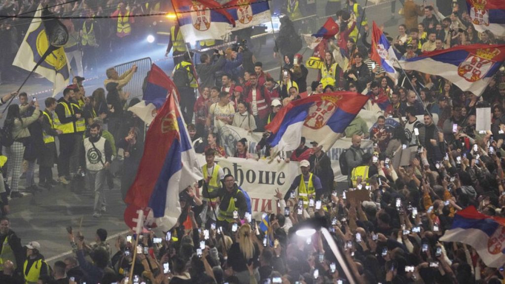 People welcome protesters from provinces who have arrived ahead of a major rally this weekend in downtown Belgrade, Serbia, Friday, March 14, 2025