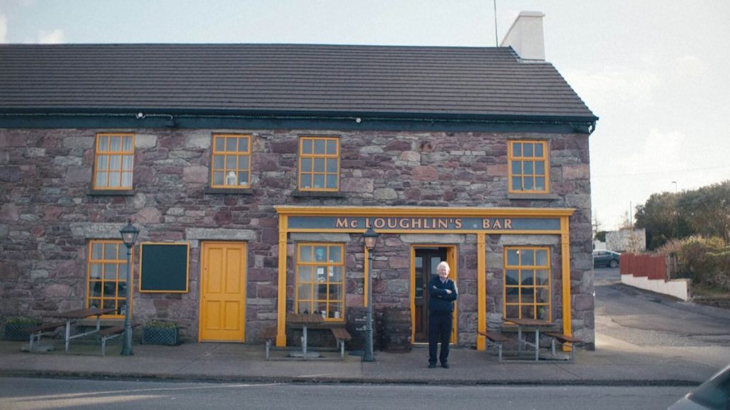 Josie McLoughlin stands outside his pub