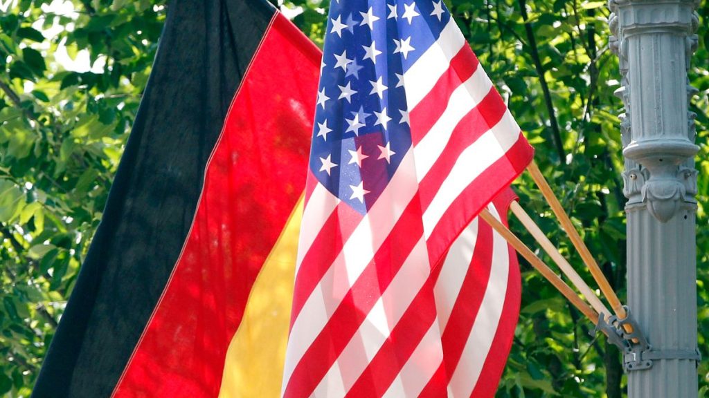 German and US flags fly on a lamppost in front of the White House in Washington DC, 6 June, 2011