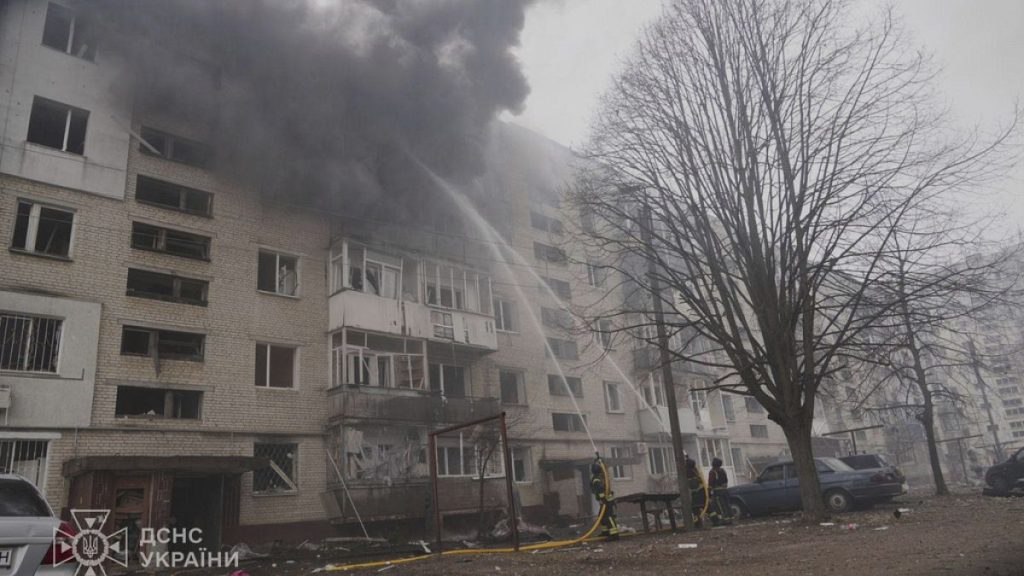 In this photo provided by the Ukrainian Emergency Service, firefighters put out the fire following a Russian attack in Sumy, Ukraine, Tuesday, March 25, 2025.