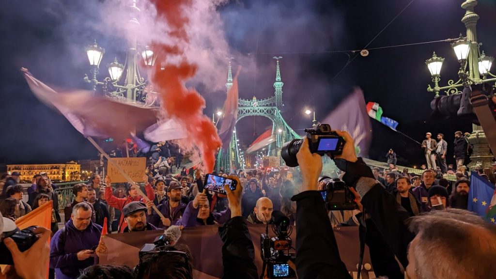 Hungarian demonstrators occupy Liberty Bridge as they protest against a law that effectively bans LGBTQ+ Pride events and restricts the right to assembly, in central Budapest,