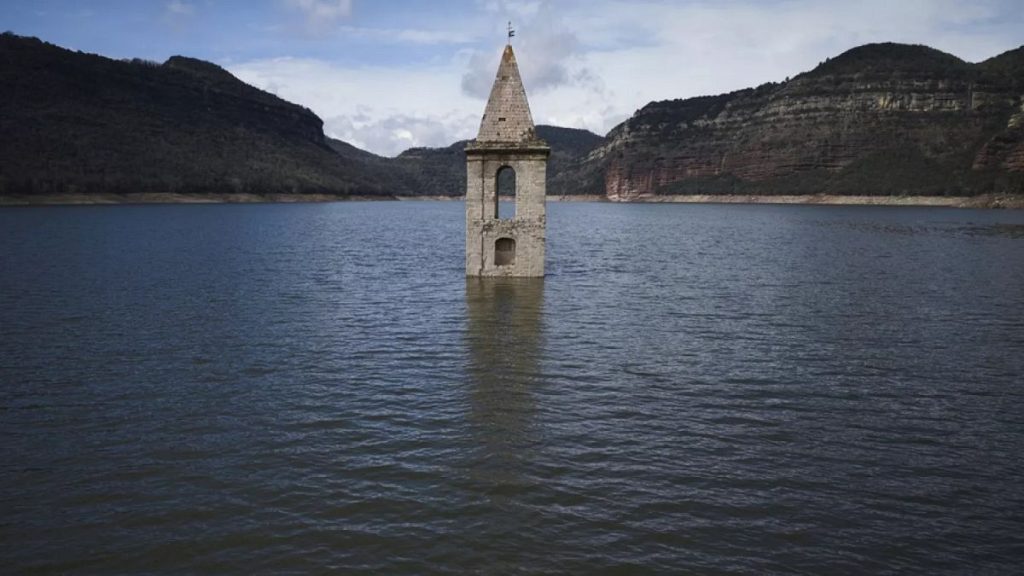 The belfry an 11th century Romanesque church emerges from the Sau reservoir in Vilanova de Sau, Spain, on Monday, March 24, 2025. (AP Photo/Emilio Morenatti)