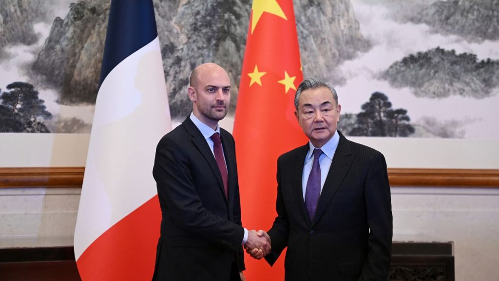 French Foreign Minister Jean- Noël Barrot is greeted by China