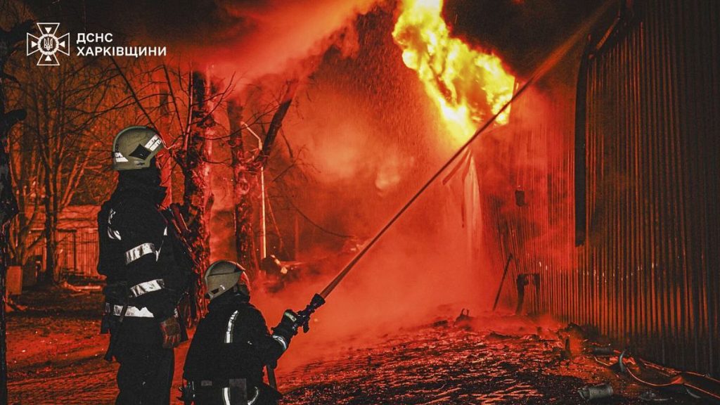 Firefighters put out the fire following a Russian attack in Kharkiv, 27 March, 2025
