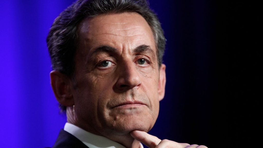 Former French President Nicolas Sarkozy attends a meeting in Asnieres outside Paris, 24 March, 2015