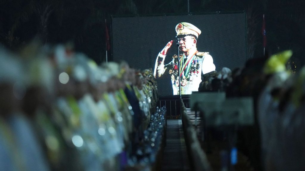 Junta chief Min Aung Hlaing is seen on a screen during a parade to commemorate Myanmar