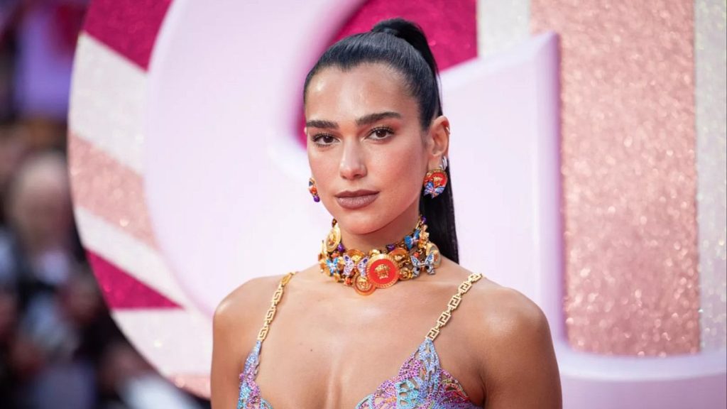 ua Lipa poses for photographers upon arrival at the premiere of the film