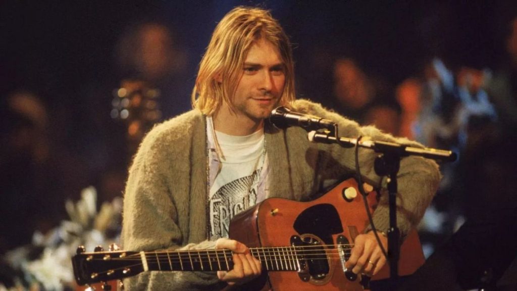 Kurt Cobain playing his acoustic guitar for the recording of Nirvana