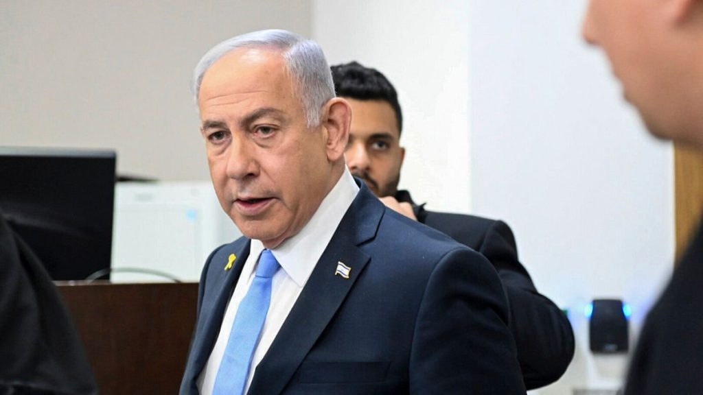 Israeli Prime Minister Benjamin Netanyahu attends his trial on corruption charges at the district court in Tel Aviv, Israel, Wednesday, Feb. 12, 2025.