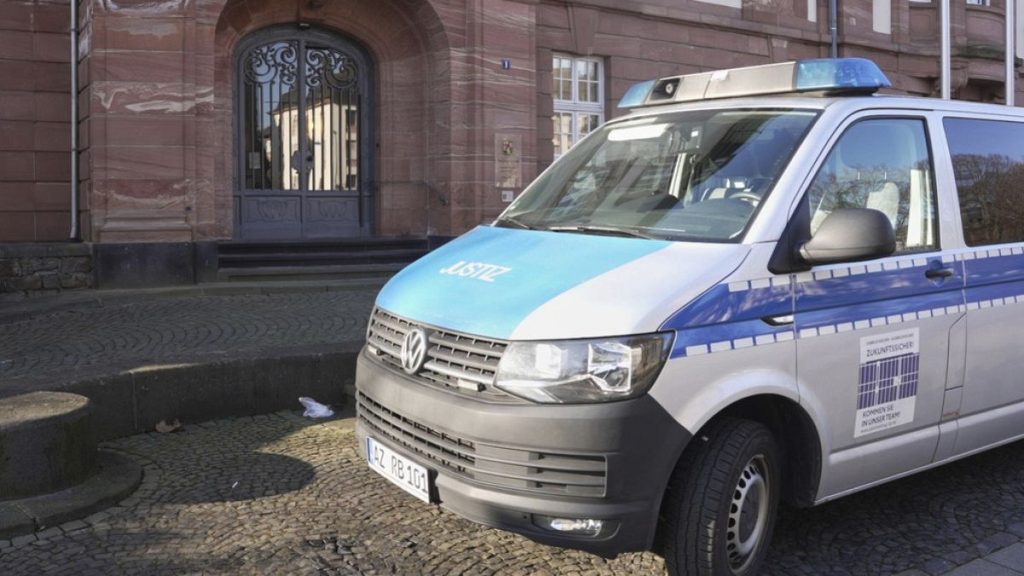 A prisoner transporter van is parked in front of the Higher Regional Court in Koblenz, Germany. Thursday, March 6, 2025.
