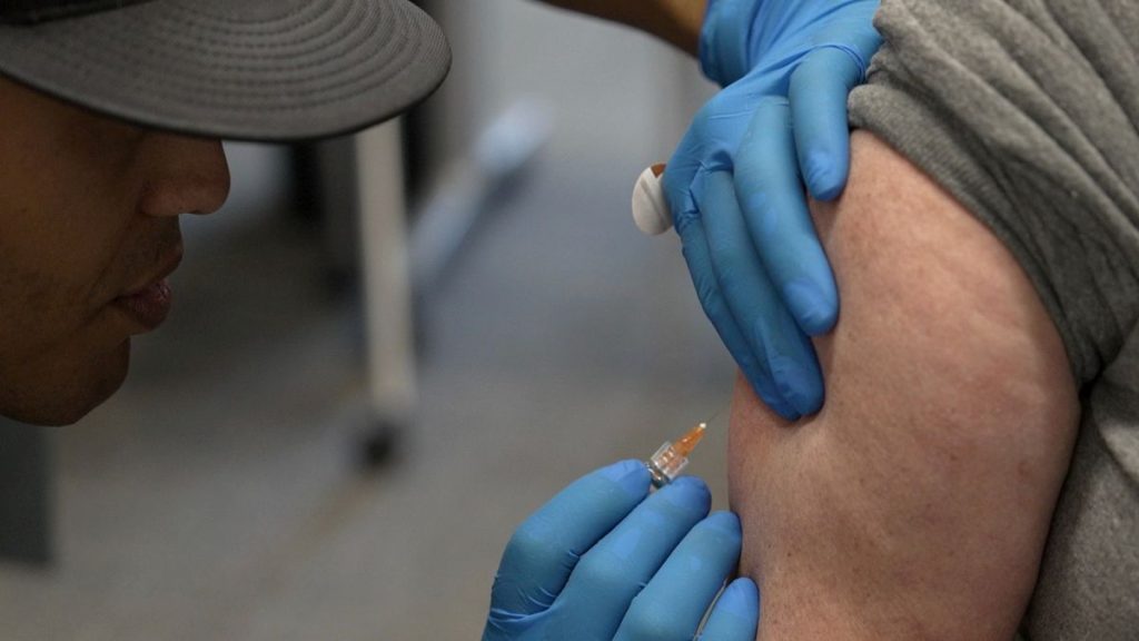 A local official administers a measles, mumps, and rubella vaccine in the US state of Texas in February 2025.