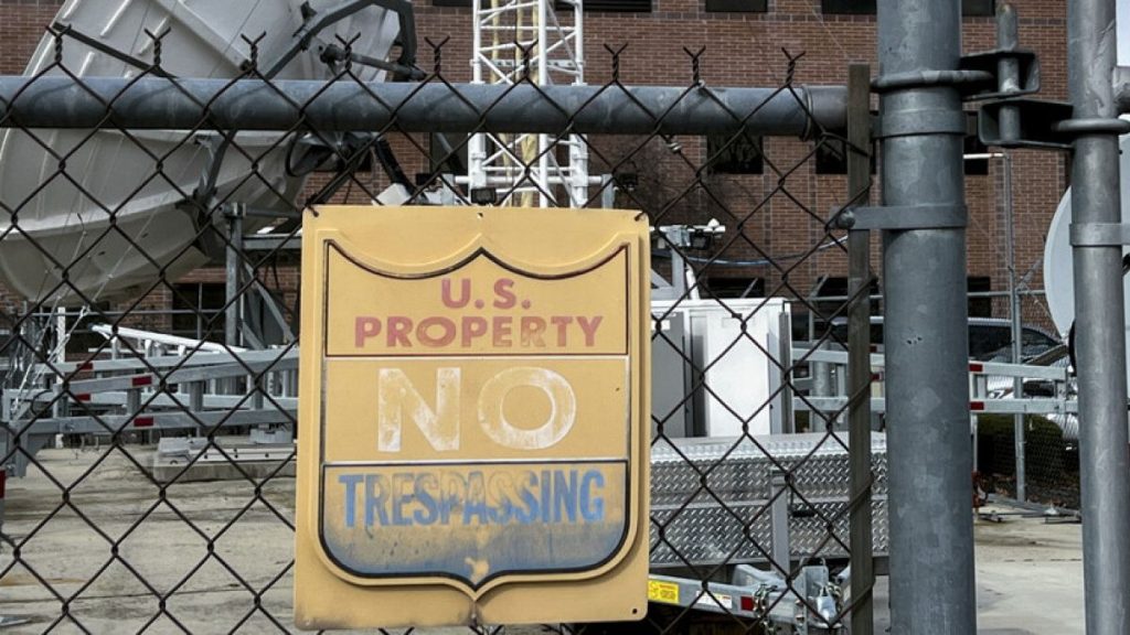 A chain link fence protects a satellite station and other equipment behind the Bureau of Reclamation office Thursday, March 13, 2025, in Boise, Idaho