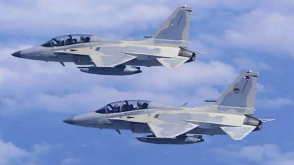Two Philippine Air Force FA-50 fighter jets fly during a joint patrol and training session with the US over the South China Sea on 4 February, 2025.
