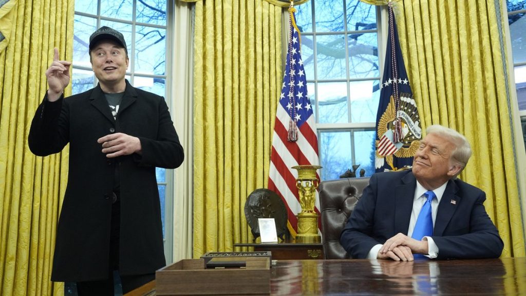 President Donald Trump listens as Elon Musk speaks in the Oval Office at the White House, Tuesday, Feb. 11, 2025, in Washington.