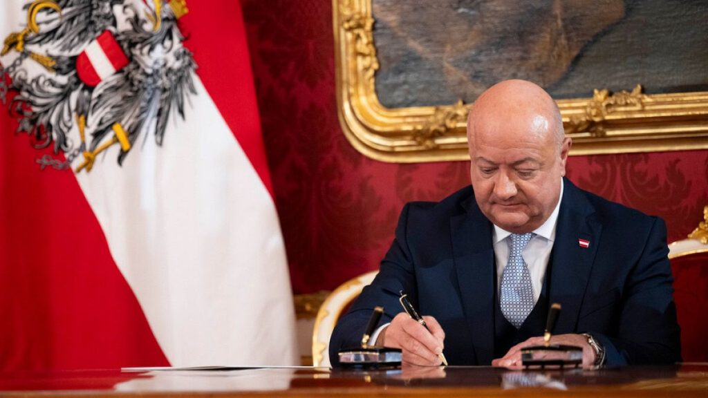 Chancellor Christian Stocker signs papers during the swearing-in ceremony of the Federal Government in the presidential office at the Hofburg Palace, in Vienna, Austria.