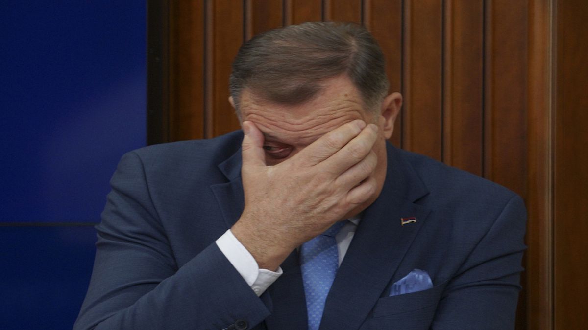 Bosnian Serb President Milorad Dodik gestures during a news conference after Bosnian prosecutors ordered the detention of three top Bosnian Serb officials.