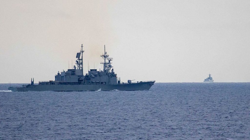 In this photo released by the Taiwan Ministry of National Defence, Taiwan guided missile destroyer monitors Chinese guided missile destroyer, 23 May 2024.