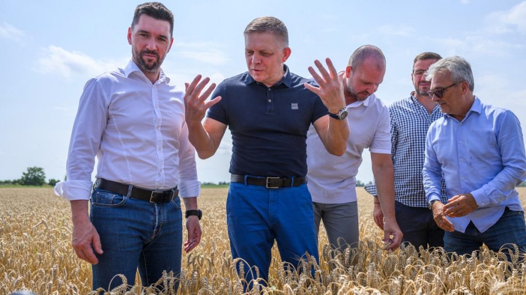 Slovak Prime Minister Robert Fico, centre, and Agriculture Minister Richard Takáč, left, visit a farm in western Slovakia,