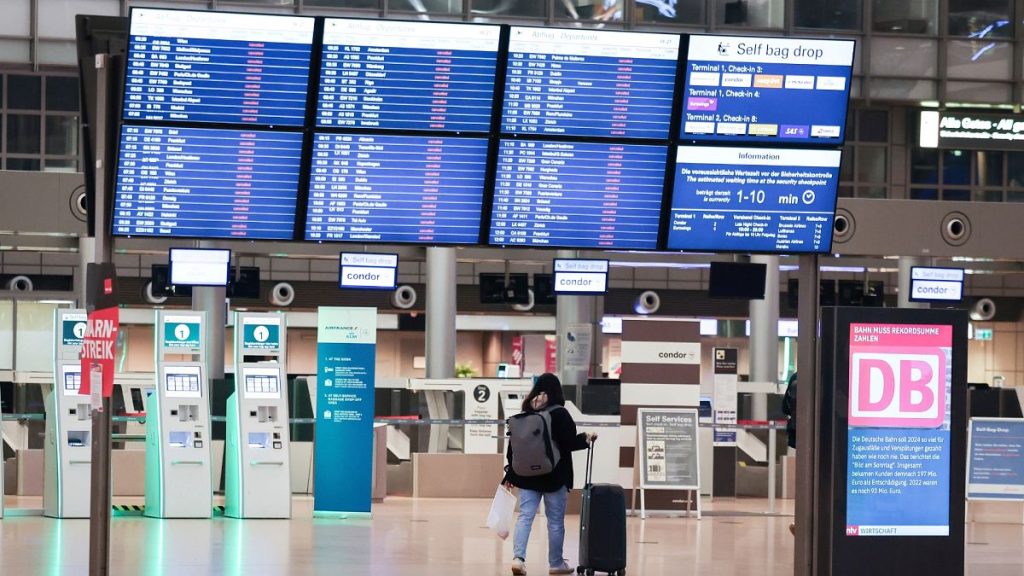 A display in Terminal 1 at Hamburg Airport, Germany shows that all departures have been cancelled Monday, 10 March.